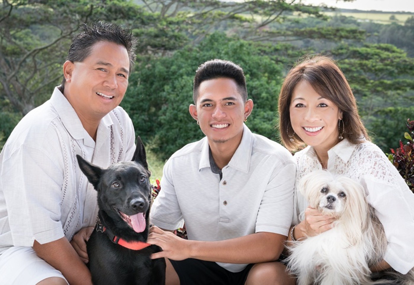 Dr. Baysa with his family and their two dogs